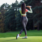 Tail Activewear woman with active wear playing golf photo