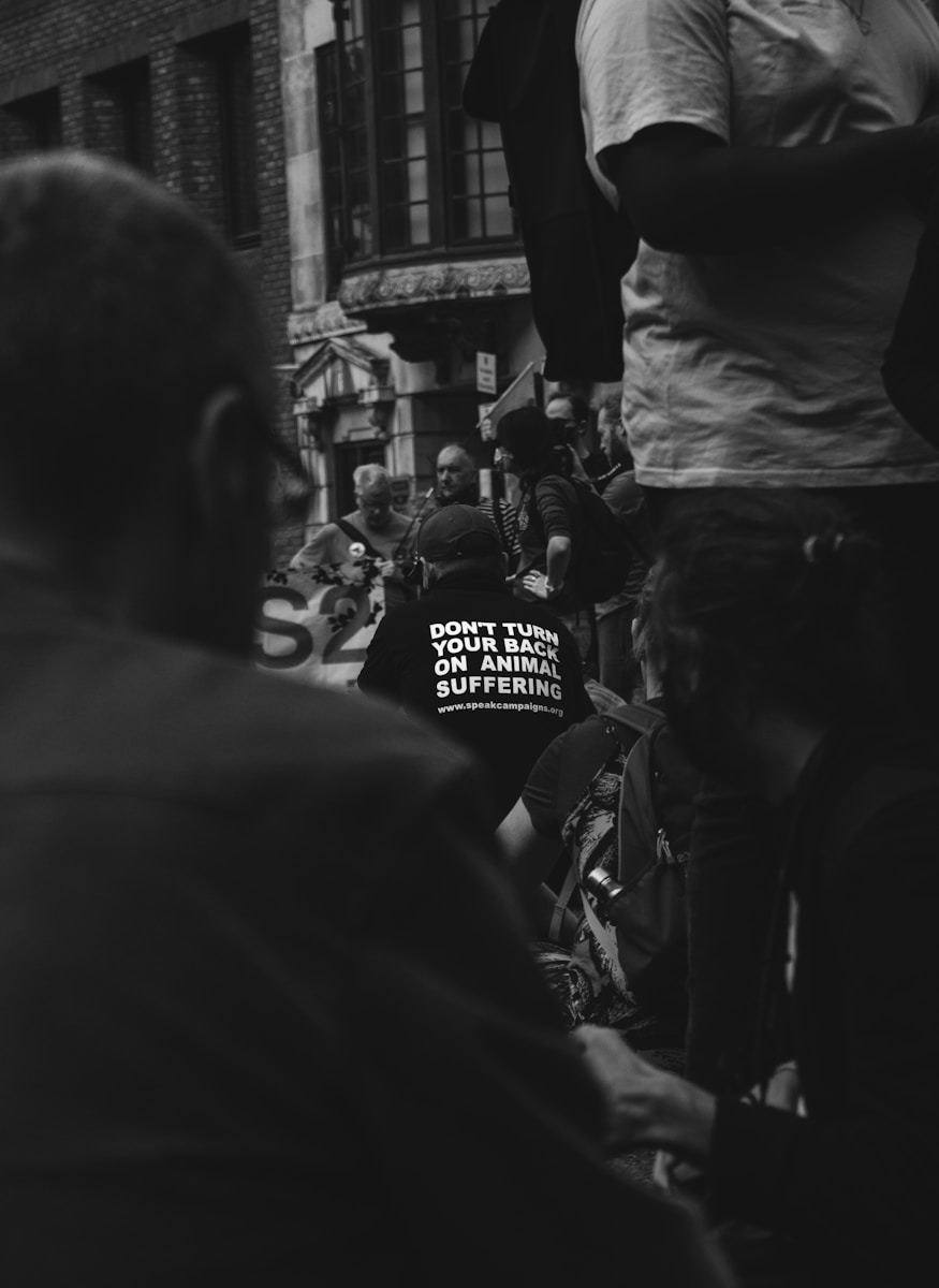 grayscale photo of people in street